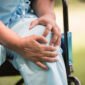 elderly woman sitting wheelchairs with knee pain 85x85